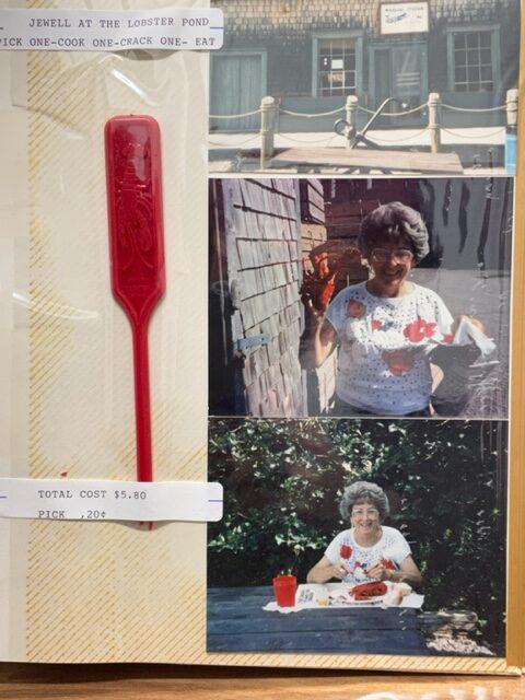 photo of scrapbook page showing Jewell Ratliff eating a lobster. Her captions read "jewell at the lobster pond, pick one, cook one, crack one, eat" and "total cost $5.80, pick $.20". 